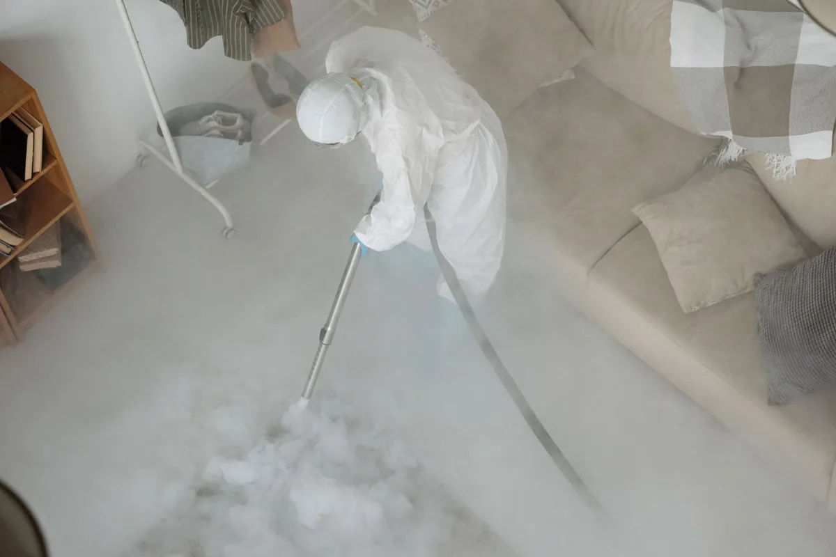 Biohazard cleanup technician in protective equipment, Hoquiam, WA